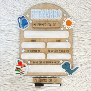 Wooden milestone board for a child's first day of school, with spaces for date, age, and favorites, plus backpack and sun stickers.